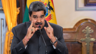 Maduro gives a speech from a desk